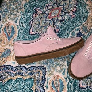 Vans. I usually wear a size 8/8.5 but these fit.